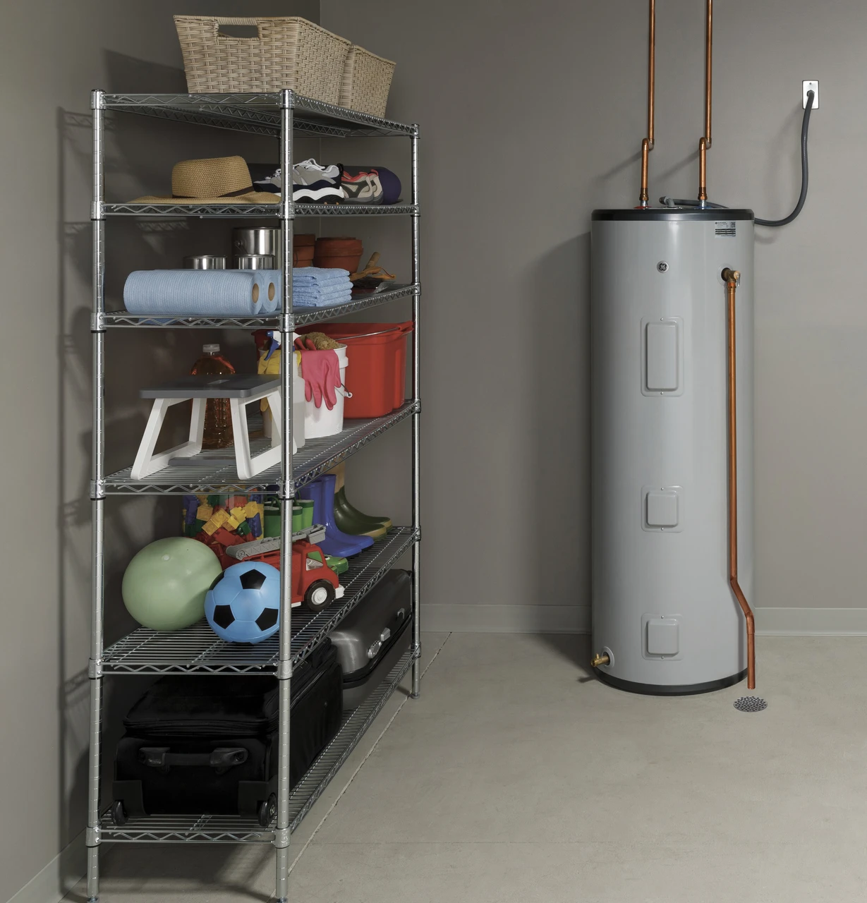 GE GE50T10BAM water heater installed beside a storage shelf