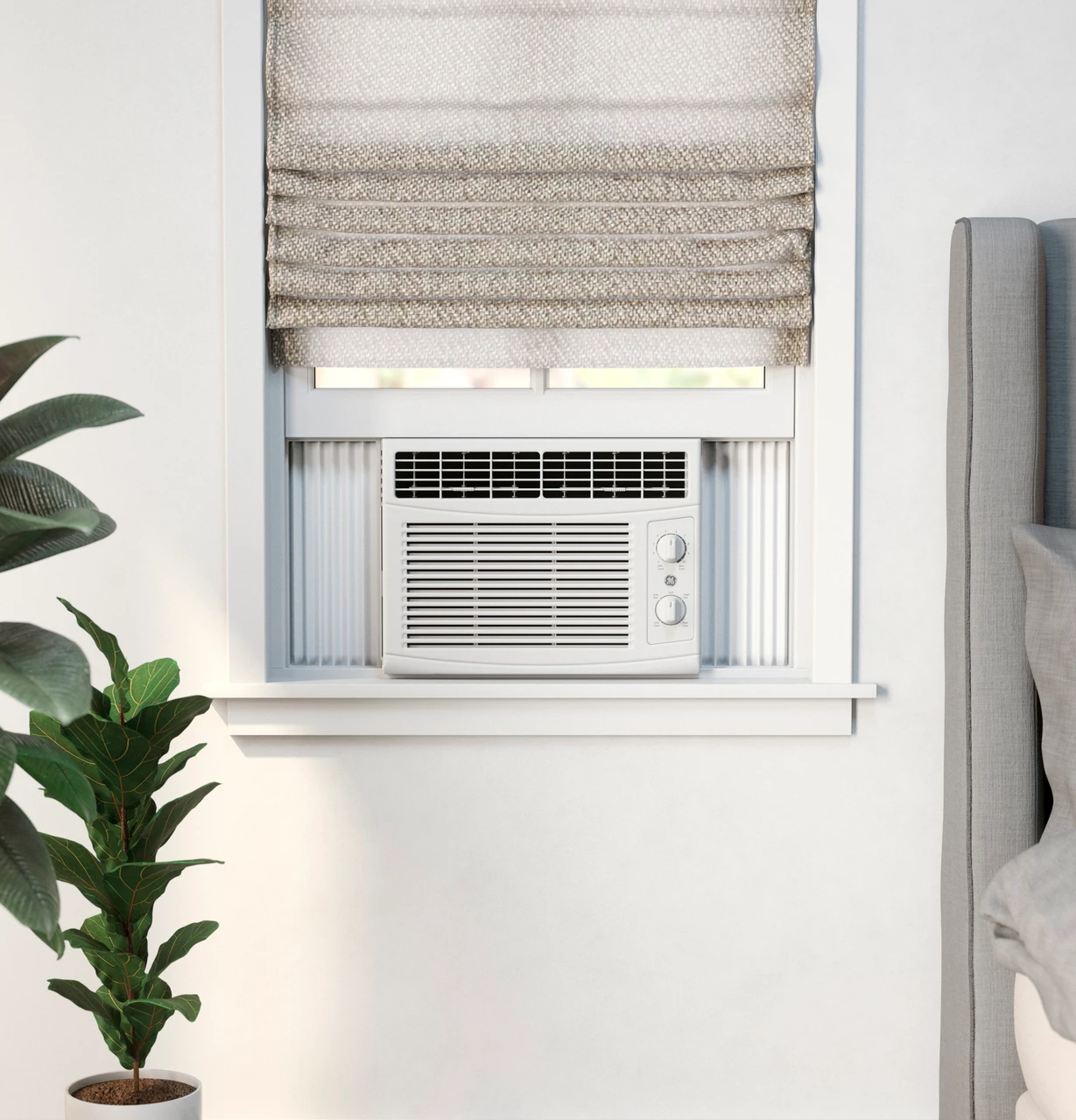 GE AHEC05AC window AC installed beside a bed